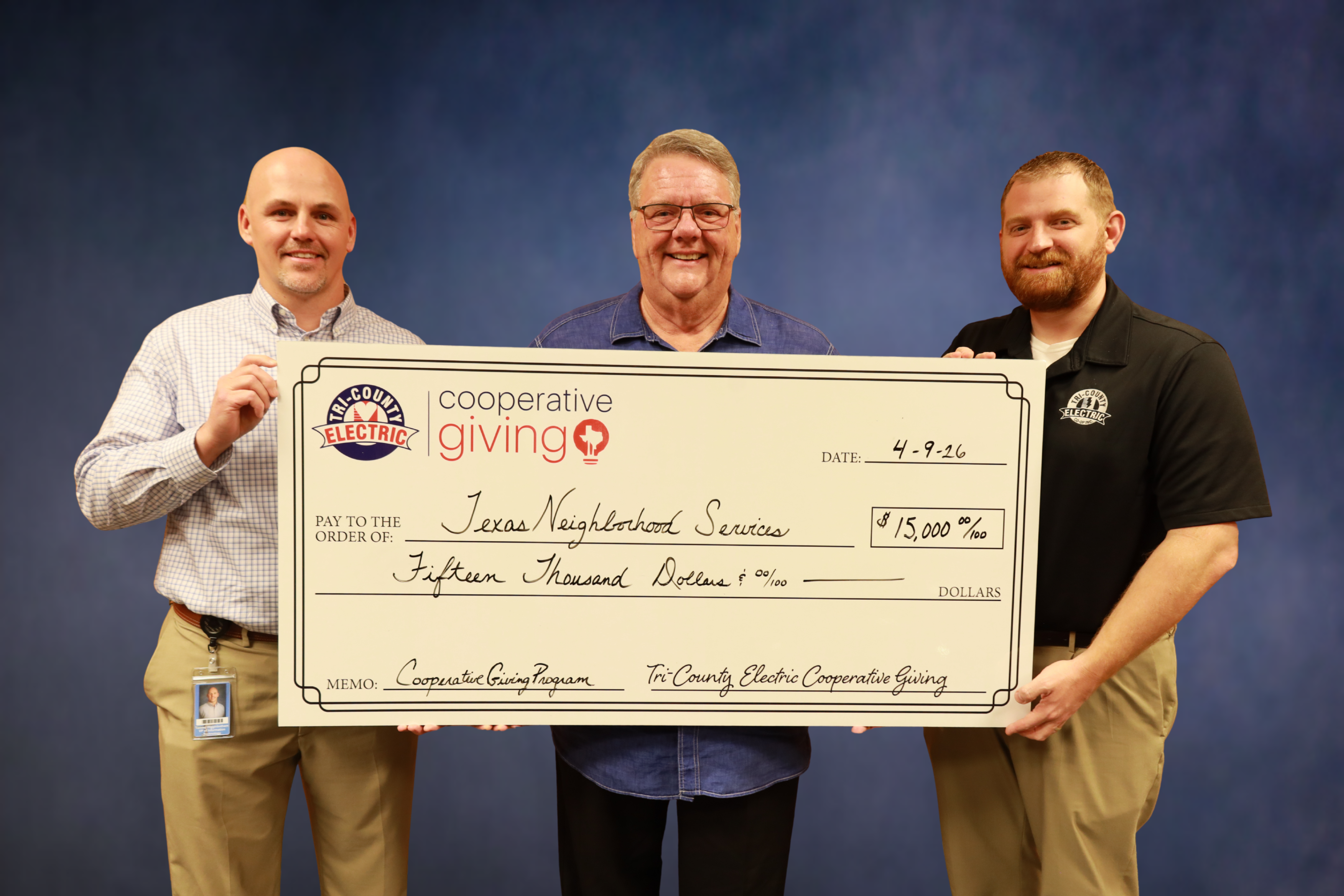 Photo of TCEC and Texas Neighborhood Services with $15,000 check