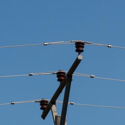 photo of electrical lines against blue background