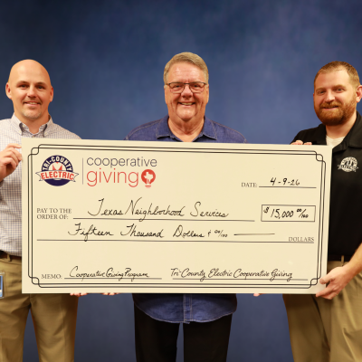 Photo of TCEC and Texas Neighborhood Services check presenation