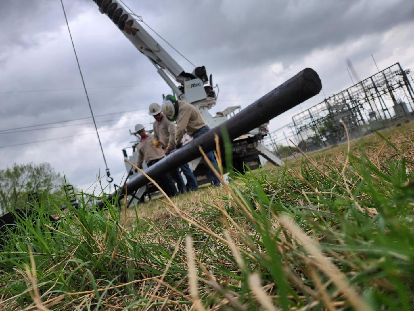 photo of lineman working on electrical pole